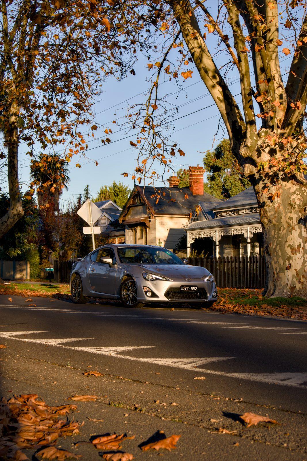 Automotive shoot on a tree-lined street at golden hour